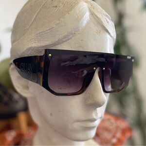 QUAY large frame sunglasses with thick sides.